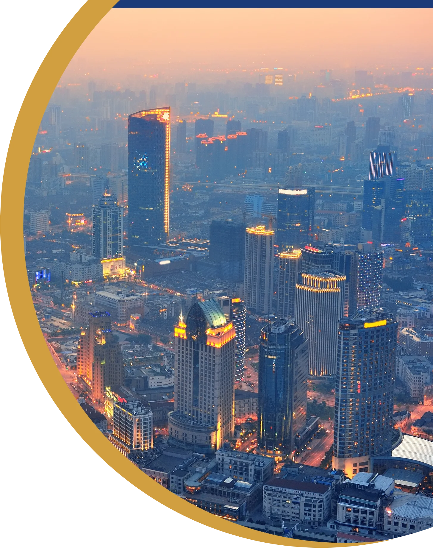 Aerial view of a modern city skyline at dusk
